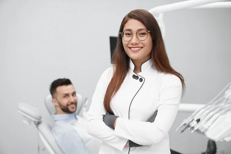 Confident dentist standing in a modern practice